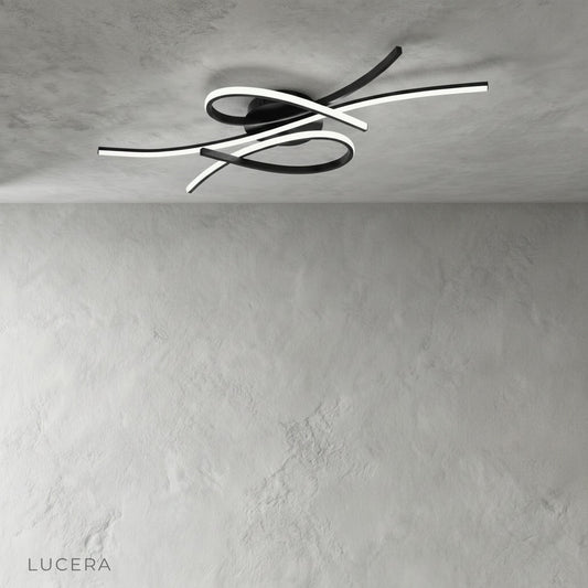 studio shot of Divination ceiling light with intertwining aluminum LED bars