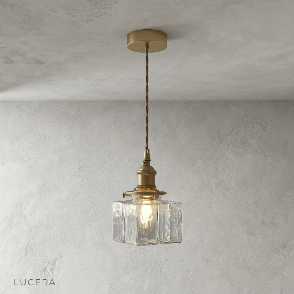 Studio view of Lucera Tucana pendant light with sleek metal cord and glass cubes