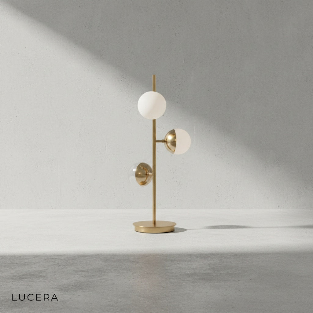 close-up of golden aluminum and iron frame with warm LED glass ball shade