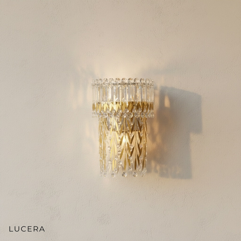 Sera wall lamp with polished gold finish and faceted crystal shade in neutral decor