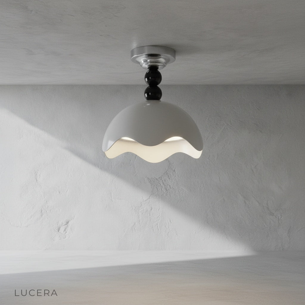 Aegis ceiling light with wave-edged shade illuminating a modern living room