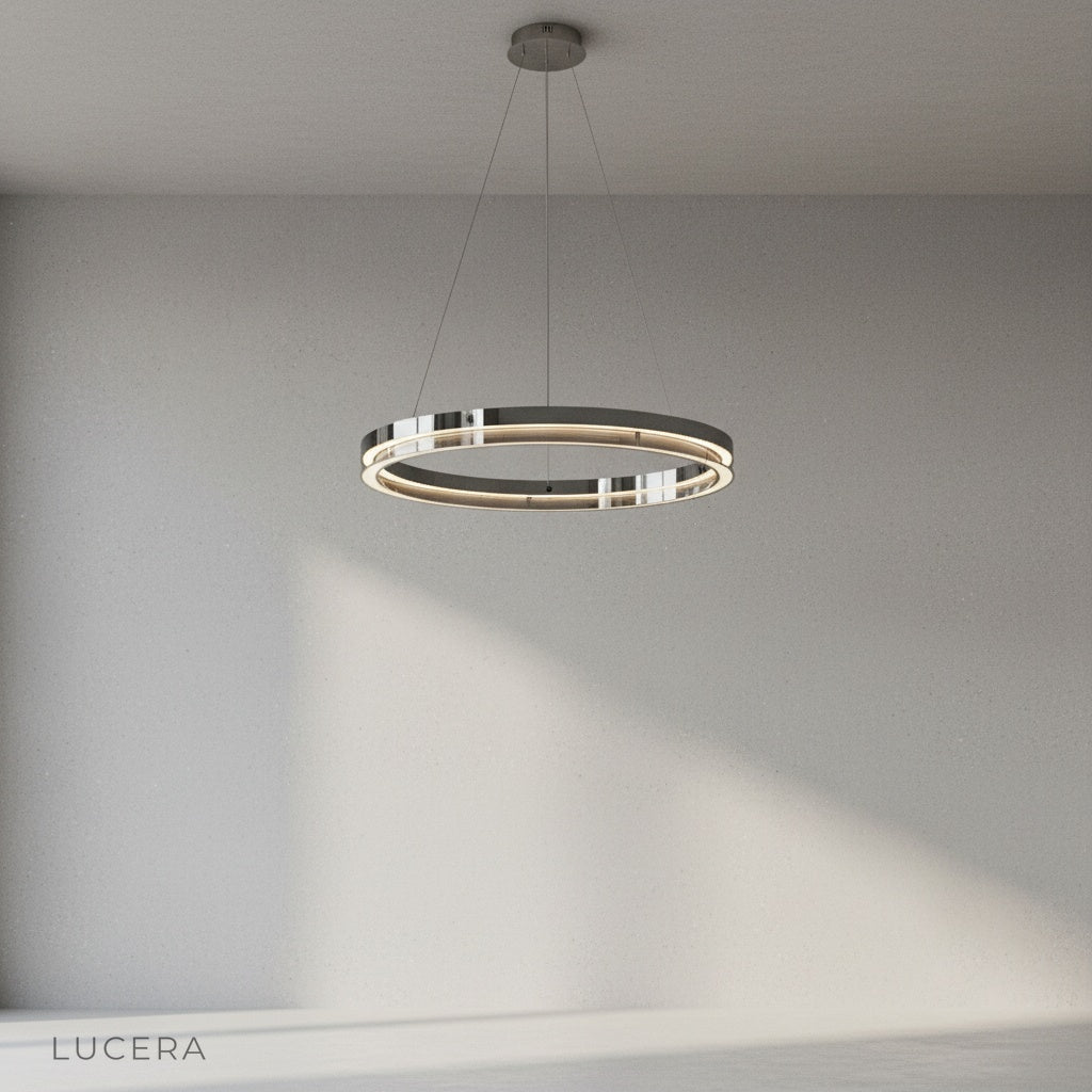 Studio shot of Zaffre dual ring chandelier with concentric steel rings and integrated LED light bars