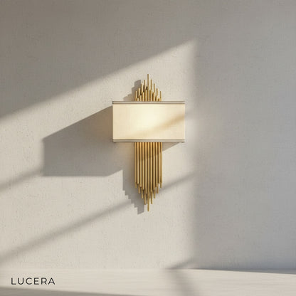 Leone wall sconce with warm LED light illuminating hallway wall in contemporary home
