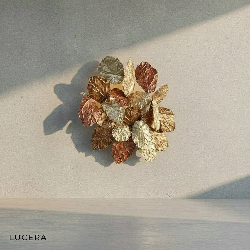 Lucera brass wall sconce styled above a wooden bedside table in a bedroom