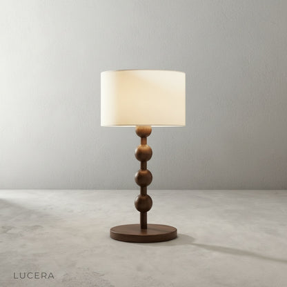 minimalist studio view of Lucera Boreal Table Lamp showing sculptural wood grain and soft linen shade