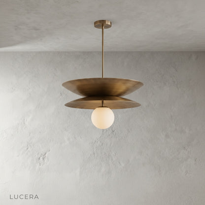 Tremulous pendant light side profile on clean white background showing brass and glass details