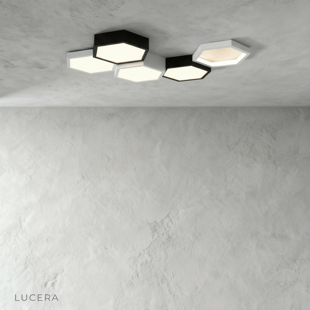 Aurelia hexagonal ceiling light angled studio view showing black and white geometric panels