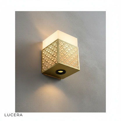 Gold and black Astragal marble wall lamp variants side by side on neutral wall