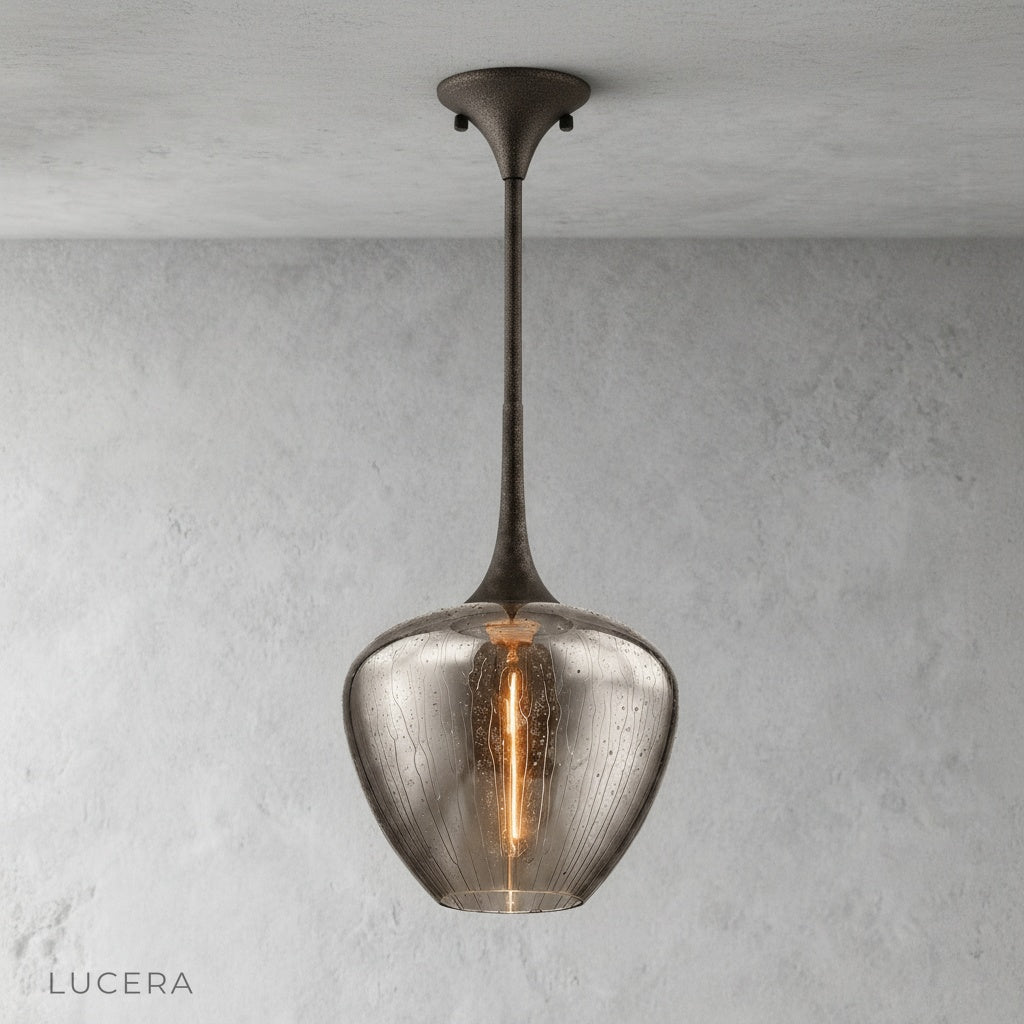 Minimalist studio view of Livid Pendant Light showing clear glass texture and black metal