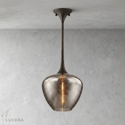 Minimalist studio view of Livid Pendant Light showing clear glass texture and black metal