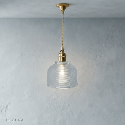 front view of Lucera Harmony Pendant Light with adjustable wire and LED bulb in studio lighting