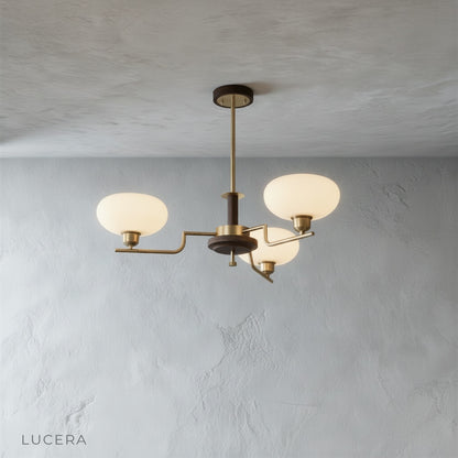front view of walnut finish inlet chandelier with five lights hanging from ceiling in clean studio setting