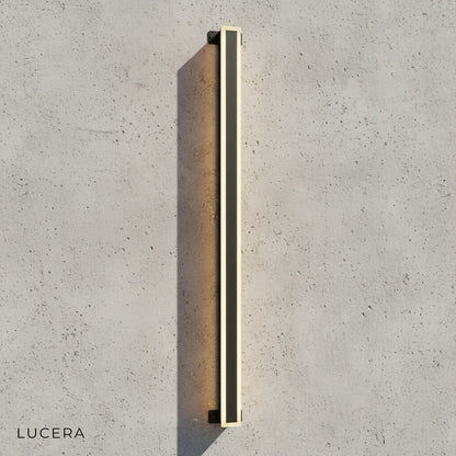 close-up detail of Odette wall lamp acrylic diffuser and aluminum frame texture in black