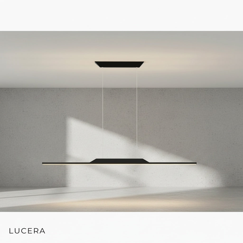 Close-up of Vind chandelier gold metal finish and black iron detailing against dark backdrop