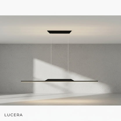 Close-up of Vind chandelier gold metal finish and black iron detailing against dark backdrop