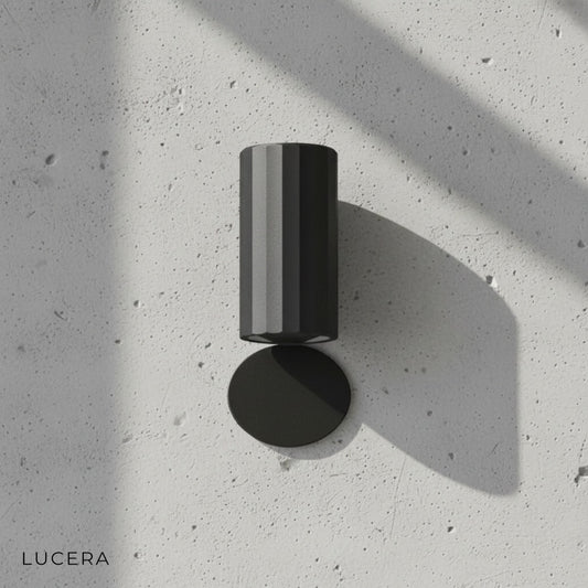 minimalist Lumen Iris outdoor sconce on clean white studio background side angle