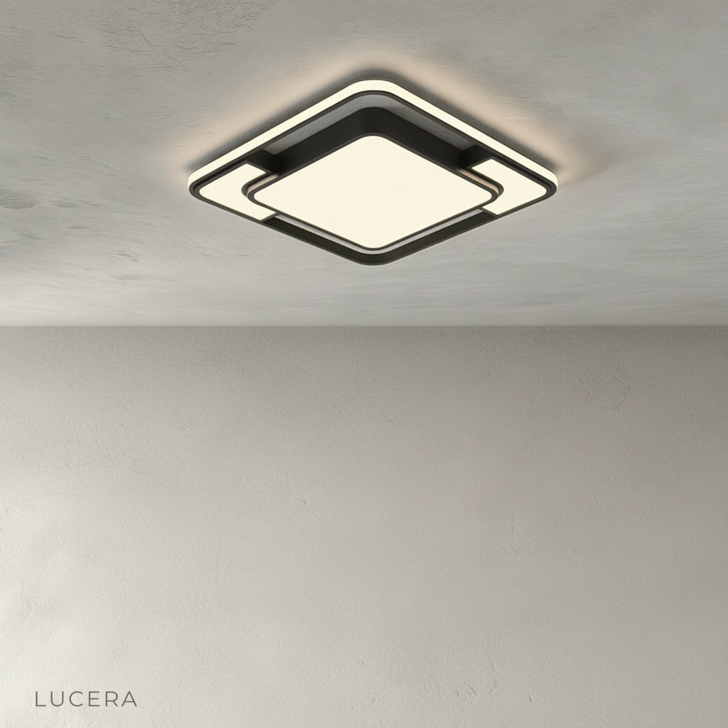 studio shot of Kyrie ceiling light with black metal frame and acrylic diffuser on clean white background