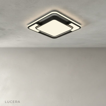 studio shot of Kyrie ceiling light with black metal frame and acrylic diffuser on clean white background