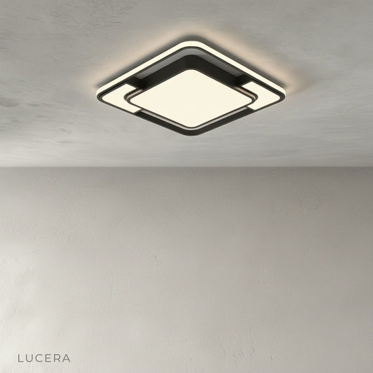 studio shot of Kyrie ceiling light with black metal frame and acrylic diffuser on clean white background