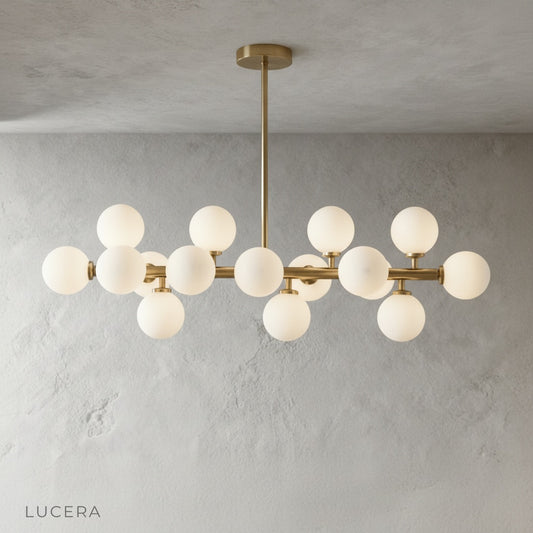 studio front view of Wisdom Chandelier gold finish with frosted glass shades on neutral backdrop
