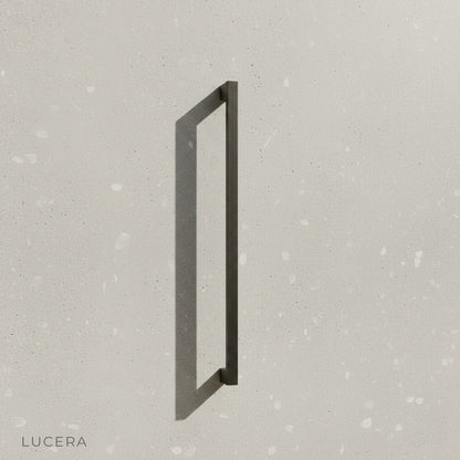 minimalist indigo wall lamp on clean white background side angle