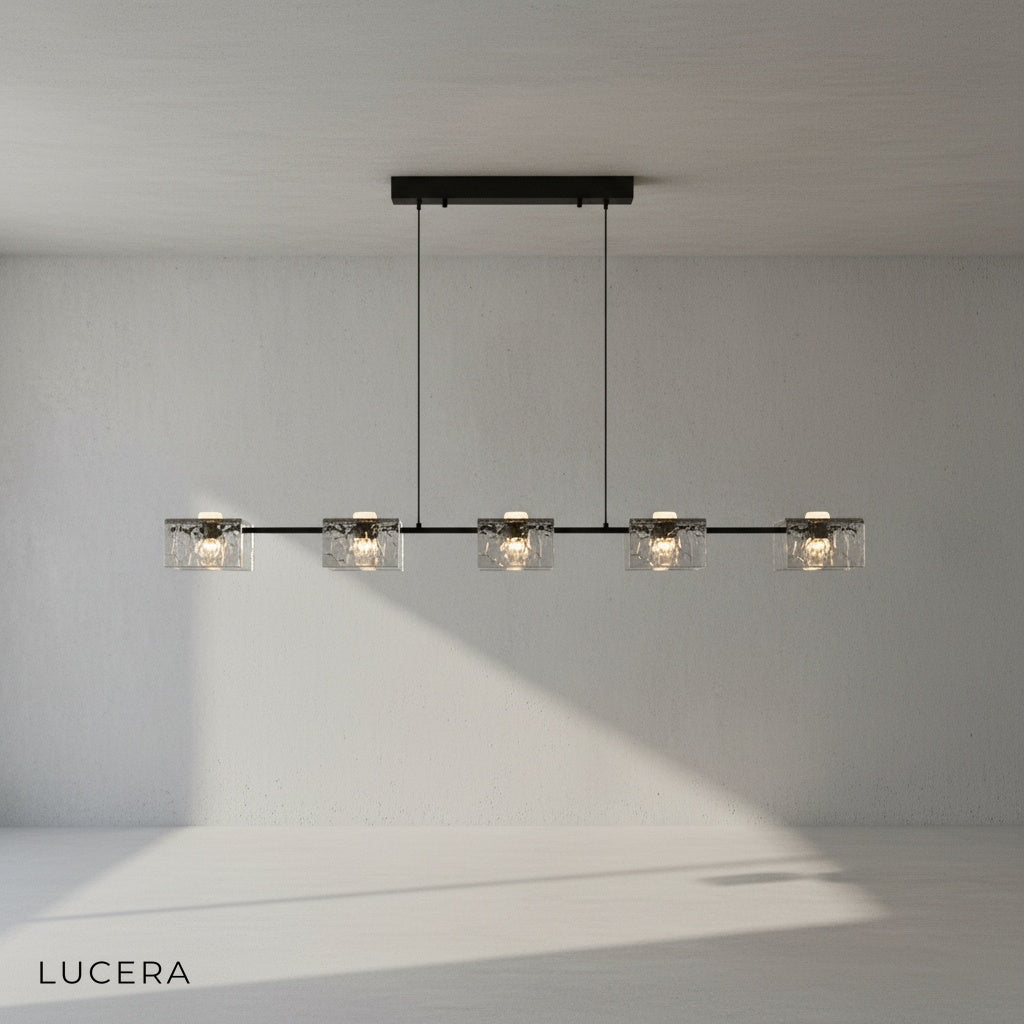 Solid copper frame detail of Cinnabar chandelier with warm metallic finish and glass texture