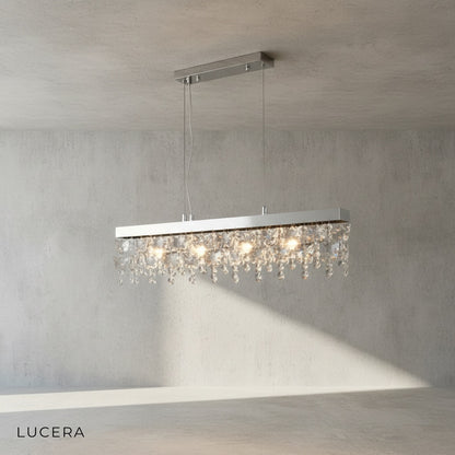 Hlin rectangular crystal LED chandelier hanging above a kitchen island with warm ambient lighting