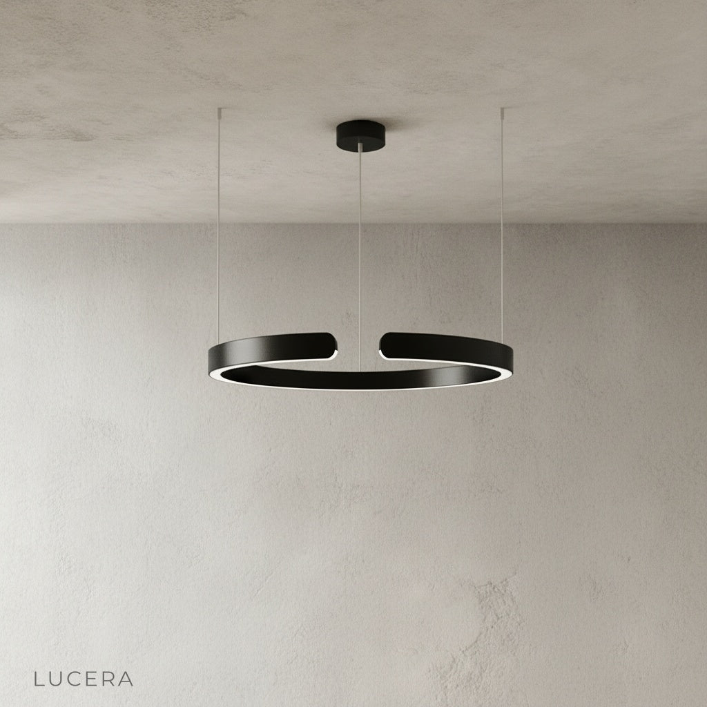 sleek aluminum ring chandelier side profile against neutral studio backdrop