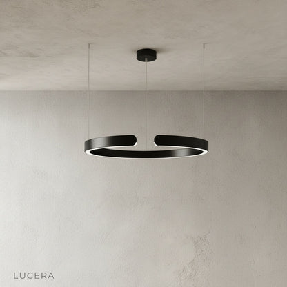 sleek aluminum ring chandelier side profile against neutral studio backdrop
