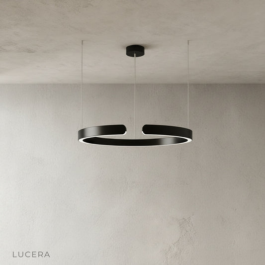 sleek aluminum ring chandelier side profile against neutral studio backdrop