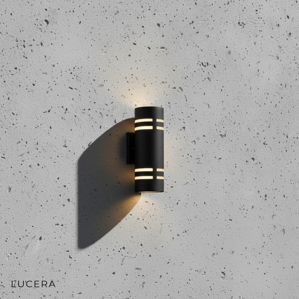 Orion smart wall light with warm LED glow mounted on brick exterior wall