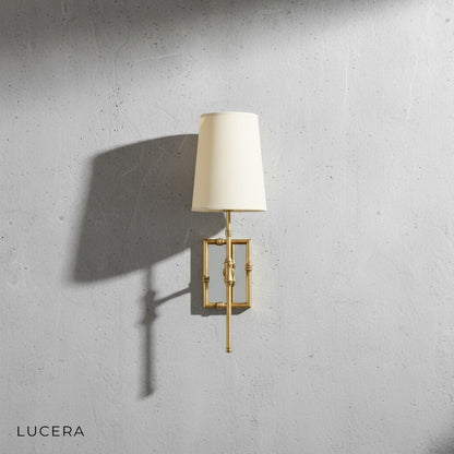 Grido wall lamp in black finish mounted on neutral wall close-up
