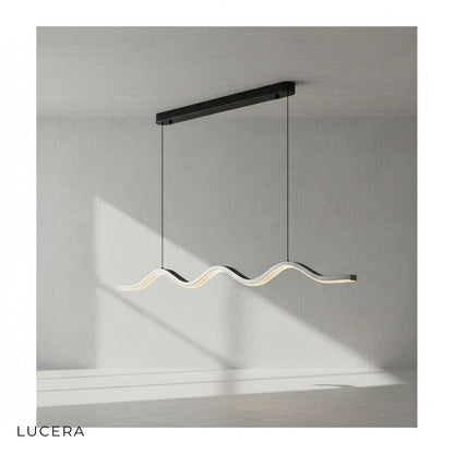 Cordovan wave pendant chandelier hanging above dining table with soft evening glow