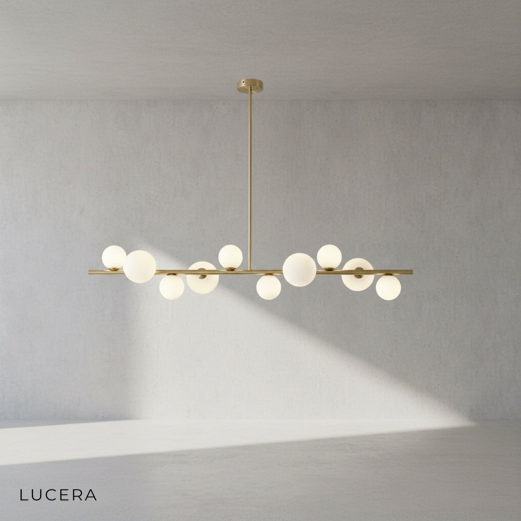 Close-up of frosted glass shade and brushed copper finish on Ran Linear Chandelier