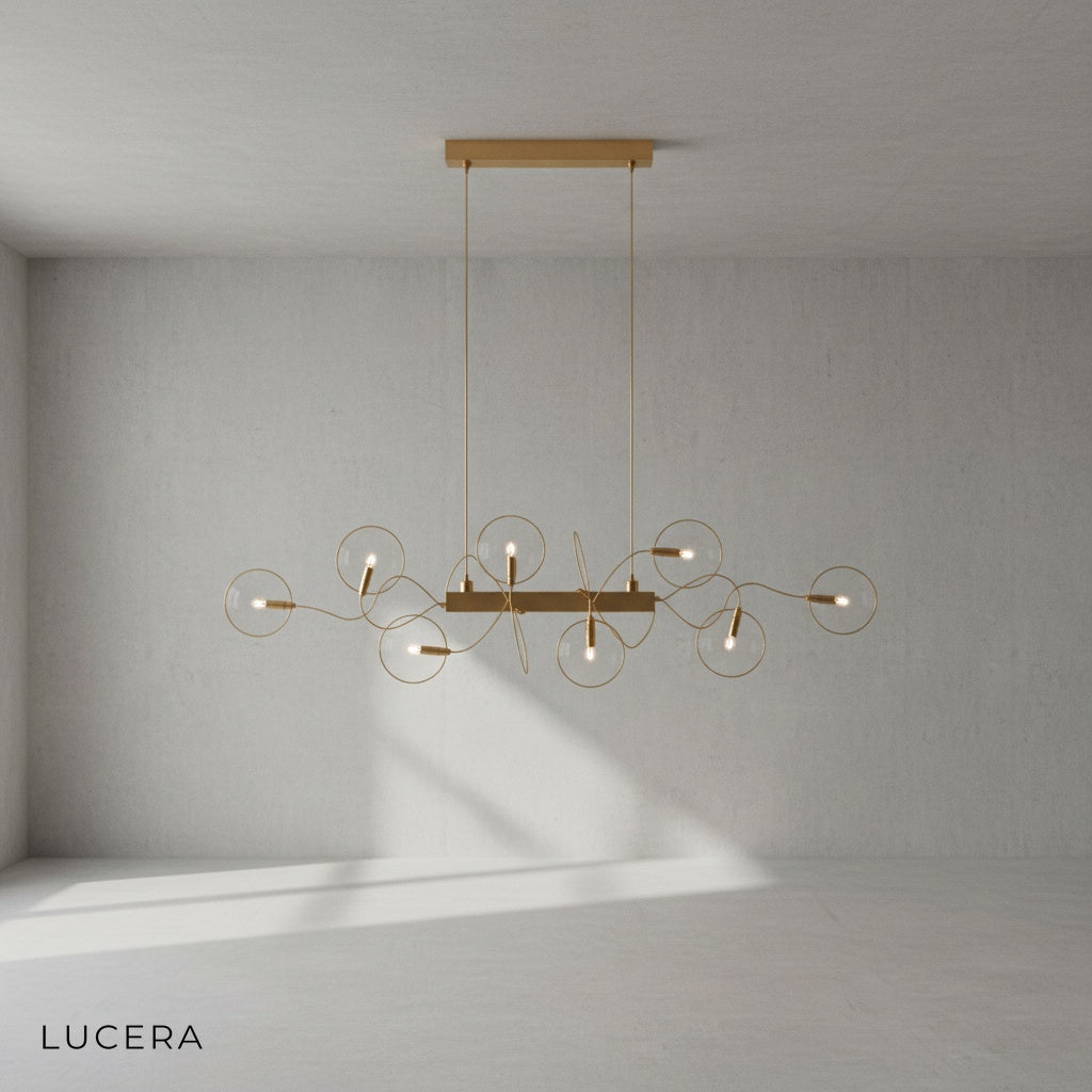 close-up of clear glass shade and brushed steel frame of Astrid chandelier