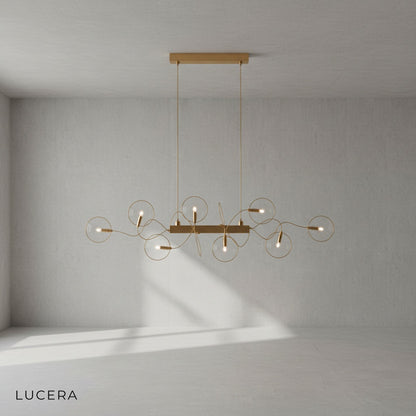 close-up of clear glass shade and brushed steel frame of Astrid chandelier