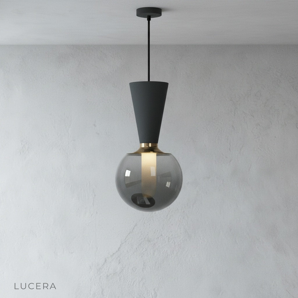 minimalist Ivan pendant light hanging from ceiling on clean white studio background