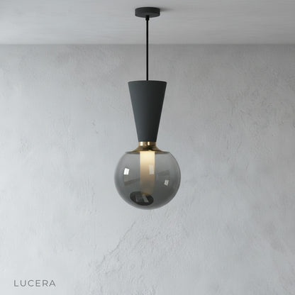 minimalist Ivan pendant light hanging from ceiling on clean white studio background