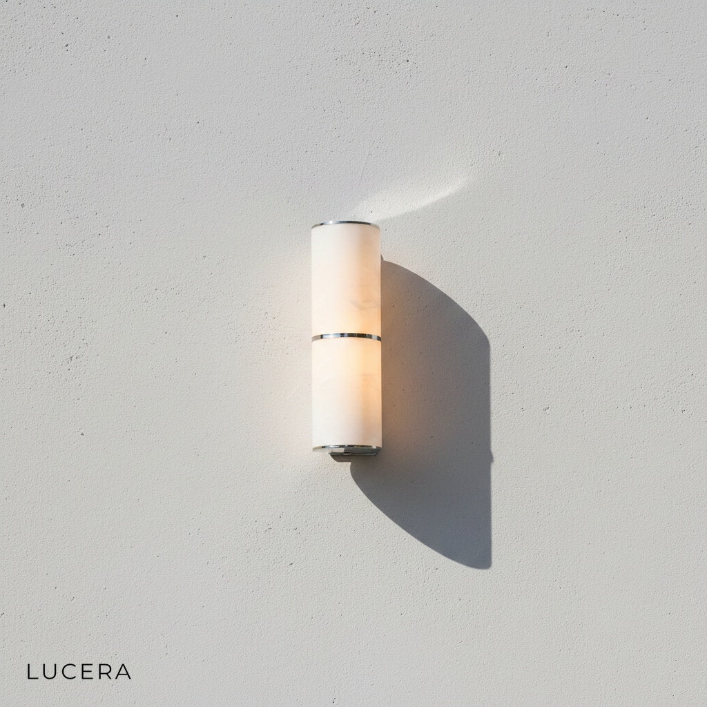 close-up detail of marble texture and brass fitting on Vague wall lamp against neutral wall