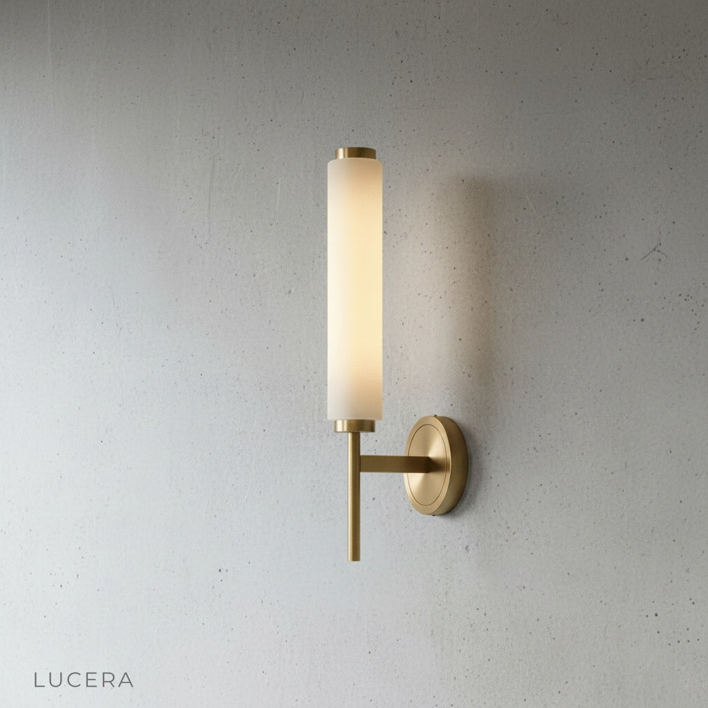 Side angle studio view of Boreas wall lamp showing slender vertical silhouette and copper details