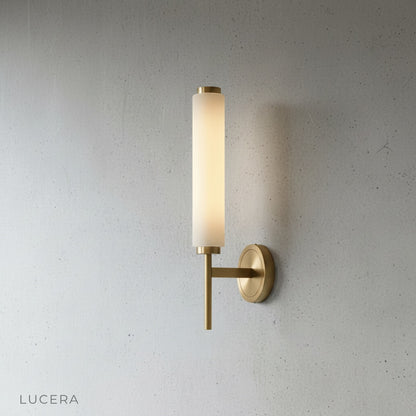 Side angle studio view of Boreas wall lamp showing slender vertical silhouette and copper details