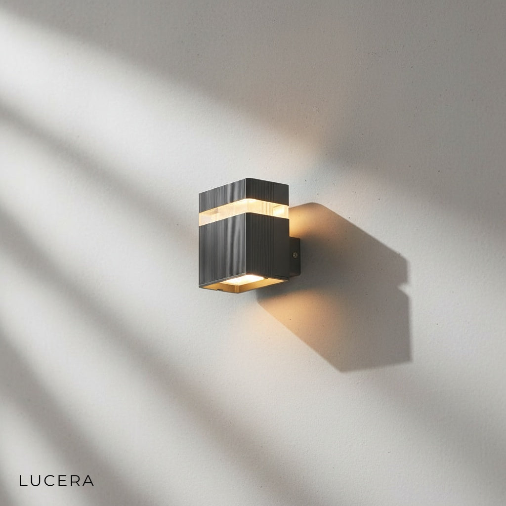 Studio front view of Lucera Reese outdoor sconce showing sleek rectangular silhouette