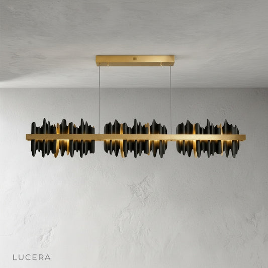 Front view of the Yield Linear Chandelier with clear crystal strands and sleek metal frame