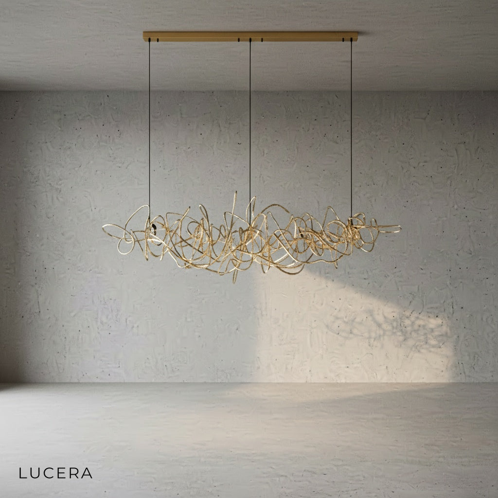 close-up of rose gold Isabelline rectangle chandelier showing reflective metal surface and sleek joints