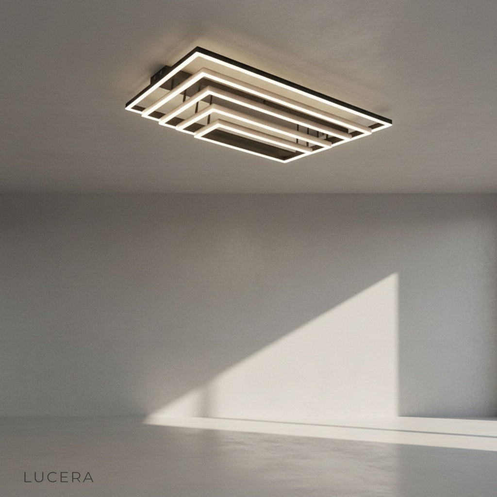 front view of rectangular LED ceiling light with brushed metal frame and soft diffused lighting in studio setting