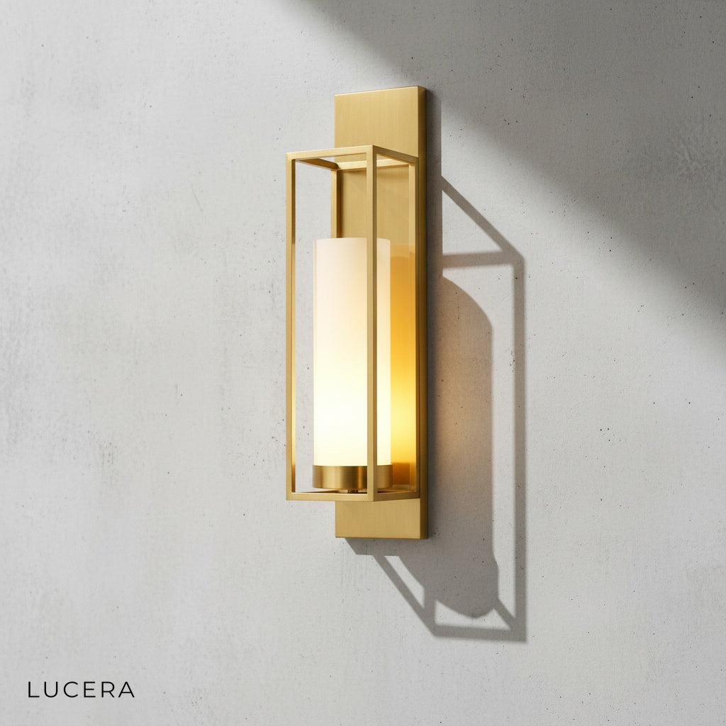 Close-up of ornate copper detailing and luminous glass shade on wall sconce