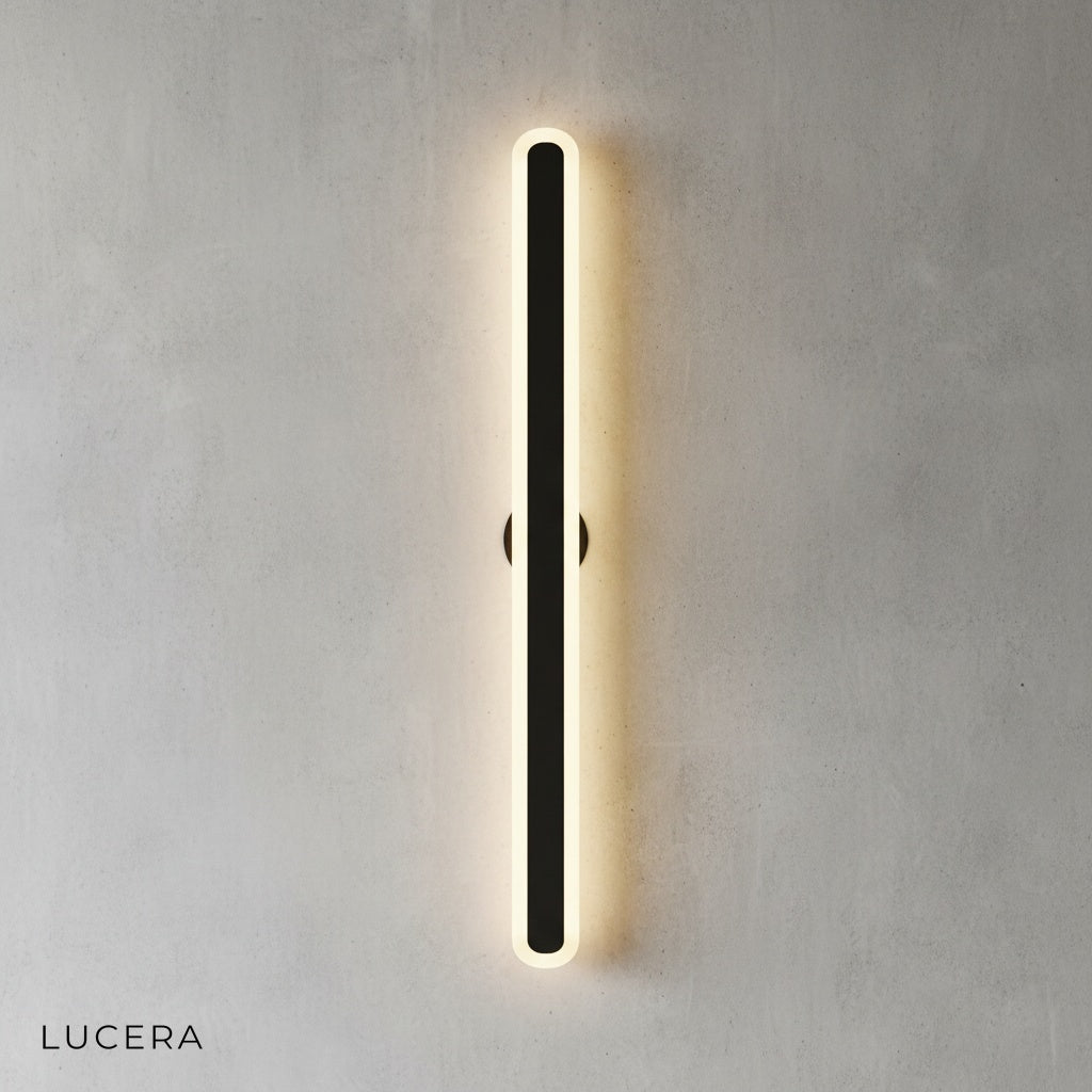 Close-up of Diminuendo wall lamp showing brushed metal mount and acrylic edge