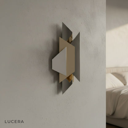 Close-up detail of antique brass finish on Scherzo wall lamp