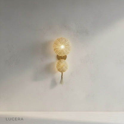 minimalist studio view of gold finish Sacro wall art lamp angled right on neutral backdrop