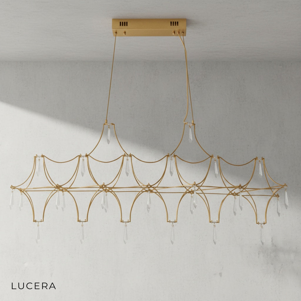 close-up of gold-finished chandelier frame with faceted crystal prisms